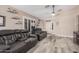 Living area featuring wood-look floors, comfortable seating, and plenty of natural light at 4262 E Sundance Ave, Gilbert, AZ 85297