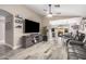 Inviting living room featuring wood-look floors, a ceiling fan and an open floor plan at 4262 E Sundance Ave, Gilbert, AZ 85297