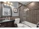 Bathroom featuring a vanity, toilet, mirror, and a shower/tub combo at 4616 E Gold Poppy Way, Phoenix, AZ 85044