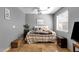 Bedroom featuring a bed, a bedside table, and a woven bench at 4616 E Gold Poppy Way, Phoenix, AZ 85044