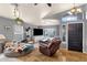 Cozy living room with vaulted ceilings, tile flooring, and comfortable seating arrangement at 4616 E Gold Poppy Way, Phoenix, AZ 85044
