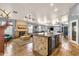 Open-concept living space featuring a fireplace and open kitchen area at 4616 E Gold Poppy Way, Phoenix, AZ 85044