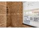 Shower featuring a tiled wall, with a window showing an outdoor view at 4616 E Gold Poppy Way, Phoenix, AZ 85044