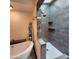 Bright bathroom featuring a modern soaking tub, walk in shower, and updated finishes at 4830 N 72Nd Way, Scottsdale, AZ 85251