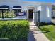 Inviting home exterior with decorative iron gate, manicured hedges, and awning, creating an appealing entrance at 4830 N 72Nd Way, Scottsdale, AZ 85251