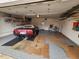 Spacious garage featuring epoxy floors, storage shelves, and ample room for vehicles and projects at 4830 N 72Nd Way, Scottsdale, AZ 85251