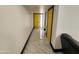 Hallway with yellow doors and modern white marble floors at 4830 N 72Nd Way, Scottsdale, AZ 85251