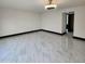 Spacious living room with marble flooring and modern lighting fixture at 4830 N 72Nd Way, Scottsdale, AZ 85251