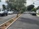 Quiet neighborhood street with mature trees lining the road and sidewalks at 4830 N 72Nd Way, Scottsdale, AZ 85251