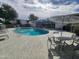 Community swimming pool area with lounge chairs and tables at 4830 N 72Nd Way, Scottsdale, AZ 85251