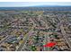 Expansive aerial view of a neighborhood showcasing its layout, homes, and surrounding landscape at 5627 W Comet Ave, Glendale, AZ 85302