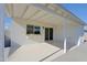 Inviting covered back patio with sliding glass doors and painted brickwork for outdoor entertaining at 5627 W Comet Ave, Glendale, AZ 85302