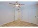 Neutral bedroom featuring a ceiling fan, tile floors, and large closet for efficient storage at 5627 W Comet Ave, Glendale, AZ 85302
