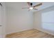 Neutral bedroom featuring a ceiling fan, tile floors, and natural light from a bright window at 5627 W Comet Ave, Glendale, AZ 85302