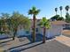 A beautiful exterior view showcasing a landscaped front yard with mature trees and a well-maintained home at 5627 W Comet Ave, Glendale, AZ 85302
