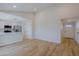 Open floor plan featuring a large living area flowing into a modern kitchen with white cabinets at 5627 W Comet Ave, Glendale, AZ 85302