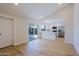 Bright living area with sliding glass doors leading to the backyard and an open kitchen concept at 5627 W Comet Ave, Glendale, AZ 85302