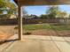 Spacious backyard featuring lush green grass, desert landscaping and a covered patio perfect for outdoor entertaining at 5976 W Alameda Rd, Glendale, AZ 85310