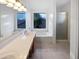 Bathroom with a large vanity, soaking tub, and walk-in shower, providing a spa-like experience at 5976 W Alameda Rd, Glendale, AZ 85310