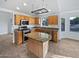 Well-equipped kitchen with stainless steel appliances and granite countertops on the island at 5976 W Alameda Rd, Glendale, AZ 85310