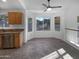 Open-concept kitchen with stainless appliances, granite counters, and a bright breakfast nook at 5976 W Alameda Rd, Glendale, AZ 85310