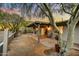 Desert landscaped backyard with covered patio and mountain views, perfect for outdoor living at 6002 E Cholla Rd, Cave Creek, AZ 85331