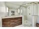 Bathroom featuring a vanity, large mirror, and glass-enclosed shower at 6002 E Cholla Rd, Cave Creek, AZ 85331