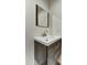 Bathroom with modern fixtures, a dark wood vanity, and a square mirror at 6002 E Cholla Rd, Cave Creek, AZ 85331