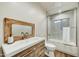 Modern bathroom with rustic wood vanity, subway tile shower, and updated fixtures at 6002 E Cholla Rd, Cave Creek, AZ 85331