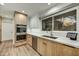 Kitchen featuring stainless steel appliances and light wood cabinetry at 6002 E Cholla Rd, Cave Creek, AZ 85331