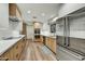 Kitchen featuring stainless steel appliances and light wood cabinetry at 6002 E Cholla Rd, Cave Creek, AZ 85331
