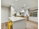 Bright kitchen features quartz breakfast bar, recessed lighting, stainless steel appliances and natural wood accents at 6002 E Cholla Rd, Cave Creek, AZ 85331