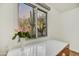 Bright office nook with a built-in desk and a view of the desert landscape at 6002 E Cholla Rd, Cave Creek, AZ 85331