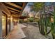 Covered patio area showcasing outdoor seating and views of the desert landscaping at 6002 E Cholla Rd, Cave Creek, AZ 85331
