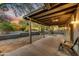 Inviting covered patio featuring ceiling fans and views of the landscaped backyard at 6002 E Cholla Rd, Cave Creek, AZ 85331