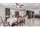 Elegant dining room, open floor plan, with view of kitchen and dining table. Well-lit and spacious at 6055 E Hannibal St, Mesa, AZ 85205