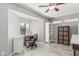 Bright home office features tile floors, ceiling fan, and an exterior window at 6055 E Hannibal St, Mesa, AZ 85205