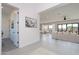 Open-concept living room with modern decor, tile floors, and bright natural light at 6509 W Apex Ave, Queen Creek, AZ 85144
