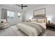 Calm main bedroom with soft natural light and tastefully coordinated furnishings and decor at 6564 W Apex Ave, Queen Creek, AZ 85144