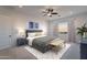 Spacious main bedroom featuring neutral paint, plush carpet, large bed, and an abundance of natural light at 6604 W Apex Ave, Queen Creek, AZ 85144