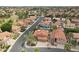 Lovely aerial view of this home in a quiet neighborhood with mature trees and community lake at 6901 W Tonto Dr, Glendale, AZ 85308