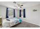 Bedroom with a large bed and plenty of natural light at 6901 W Tonto Dr, Glendale, AZ 85308