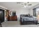 Bedroom with large bed, dresser, and ceiling fan at 6901 W Tonto Dr, Glendale, AZ 85308