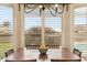 Inviting dining room with window shutters and a view of the backyard pool at 6901 W Tonto Dr, Glendale, AZ 85308