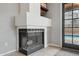 Indoor fireplace with an adjacent view of the community pool at 6901 W Tonto Dr, Glendale, AZ 85308