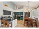 Open-concept kitchen with an island, granite countertops, and a cozy dining area at 6901 W Tonto Dr, Glendale, AZ 85308