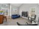 Bright and airy living room with plantation shutters, high ceilings, and a blue sofa at 6901 W Tonto Dr, Glendale, AZ 85308