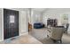 Bright living room with high ceilings, shuttered windows, and stylish furnishings at 6901 W Tonto Dr, Glendale, AZ 85308