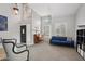 Bright living room with a piano, shuttered windows, and a blue sofa, perfect for entertaining at 6901 W Tonto Dr, Glendale, AZ 85308