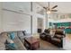 Open-concept living room with vaulted ceilings, ceiling fan, and view to a vibrant kitchen at 6901 W Tonto Dr, Glendale, AZ 85308